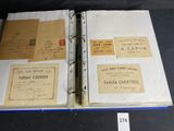 a binder with a lot of old papers on it