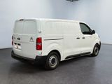 the white van is parked in the empty room of the building