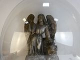 a statue of an angel inside of a glass ball