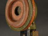 a close up of a metal object on a black background