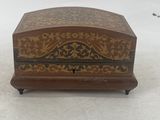 an old wooden box sitting on top of a snow covered ground