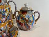two teapots sitting next to each other on a table