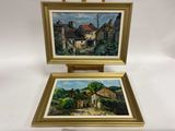 deux tableaux représentant des maisons, dans des cadres dorés, sur fond blanc