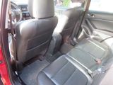 a red car with black seats in the back of it