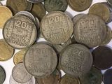 a lot of coins that are on the table