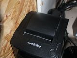 a black printer sitting on top of a desk next to other electronics