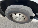 a close up of a flat tire on a car