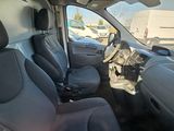a view of the inside of a van from the driver ' s seat