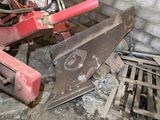 a red bulldozer that is sitting in a room