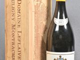 a bottle of wine sitting next to a wooden box