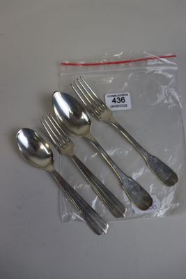 a bag of silverware on a table with a price tag