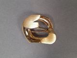 an image of a gold ring with a leaf design on it