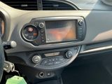 a dashboard of a car with a radio and a steering wheel