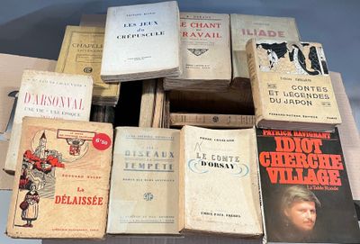 several books are stacked on top of each other on a table