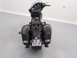 a motorcycle parked in a room with a number plate on the back