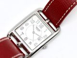 an image of a close up of a wrist watch with a red strap