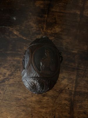 an image of a wooden table with a vase on it