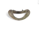 a small metal object that looks like an animal ' s mouth