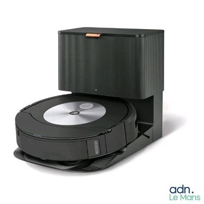 a robotic vacuum cleaner that is sitting on top of a box
