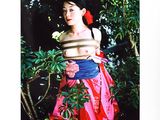 a picture of a woman holding a flower in her hand