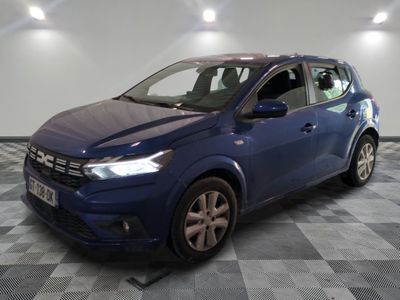 a blue car is parked in a room with a checkered floor
