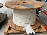 a spool on a pallet in a warehouse