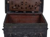 a wooden chest with a metal lock on the inside