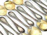 a lot of spoons that are sitting on a table