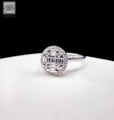 an image of a diamond ring on a white plate