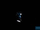 a close up of a blue diamond on a black background