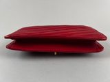 a red leather wallet with a zipper on the inside
