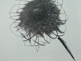 a drawing of a flower on a piece of paper on a table