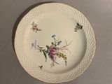 a white plate with a floral design on it