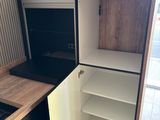 a small kitchen with a refrigerator and a stove in it