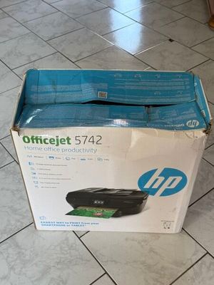 a box that is sitting on the floor with a printer in it