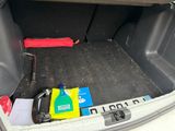 a trunk of a car with a lot of items in it