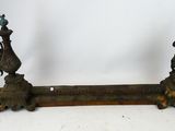 pair of antique cast iron candlesticks on wooden stand