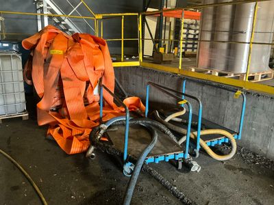 a large orange bag sitting on a cart in a building