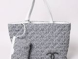 a black and white bag with an eye on it