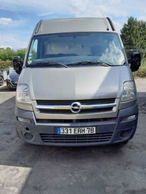 a silver van that is parked in a parking lot