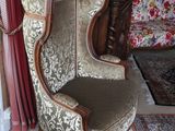 a chair that is sitting in the corner of a room