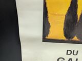 a poster with a picture of trees on it on the wall