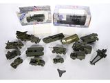 a lot of toy army vehicles in a box