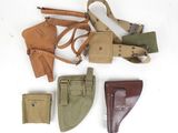 many different types of holsters laid out on a white surface