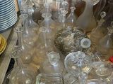 a lot of glass items on the table in the kitchen
