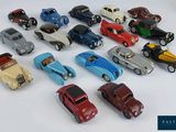 a lot of toy cars that are sitting on a table
