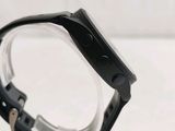 a close up of a watch on a table with a white background