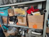 many boxes of items on a shelf in a room
