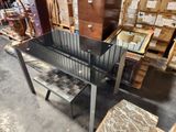a glass table with a bench in the middle of it