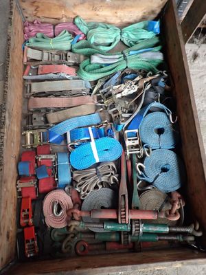 a wooden box filled with different types of rope